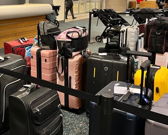 Travel luggage collected at an airport counter
