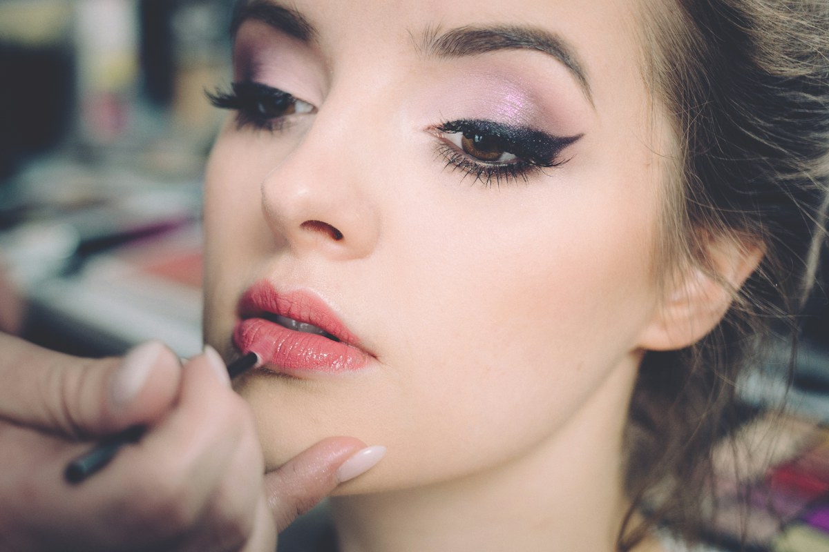 Makeup artist applying makeup for a client